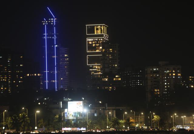 The house of Reliance Industries Chairman Mukesh Ambani is seen illuminated, centre, ahead of the wedding of his daughter Isha, in Mumbai. (AP) The house of Reliance Industries Chairman Mukesh Ambani is seen illuminated, centre, ahead of the wedding of his daughter Isha, in Mumbai. (AP)