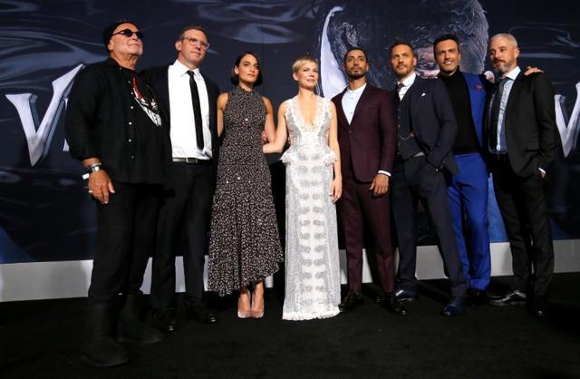 Director Ruben Fleischer (2nd L), producers Avi Arad (L) and Matt Tolmach (R) with cast members (3rd L-2nd R) Jenny Slate, Michelle Williams, Riz Ahmed, Tom Hardy and Reid Scott attend the premiere for the movie Venom in Los Angeles. (REUTERS) Director Ruben Fleischer (2nd L), producers Avi Arad (L) and Matt Tolmach (R) with cast members (3rd L-2nd R) Jenny Slate, Michelle Williams, Riz Ahmed, Tom Hardy and Reid Scott attend the premiere for the movie Venom in Los Angeles. (REUTERS)