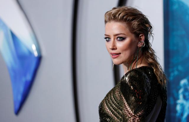 Amber Heard poses at the premiere for Aquaman in Los Angeles, California. (REUTERS) Amber Heard poses at the premiere for Aquaman in Los Angeles, California. (REUTERS)