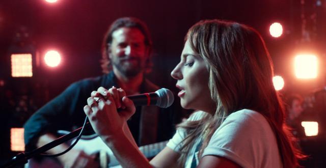 This image released by Warner Bros. shows Bradley Cooper, left, and Lady Gaga in a scene from the latest reboot of the film, A Star is Born. (AP) This image released by Warner Bros. shows Bradley Cooper, left, and Lady Gaga in a scene from the latest reboot of the film, A Star is Born. (AP)