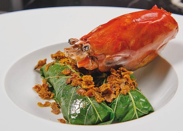 Grilled river prawn wrapped in mulberry leaves with northern Thai Mah Kwan pepper and ant eggs make for a great entrée at Paste Grilled river prawn wrapped in mulberry leaves with northern Thai Mah Kwan pepper and ant eggs make for a great entrée at Paste