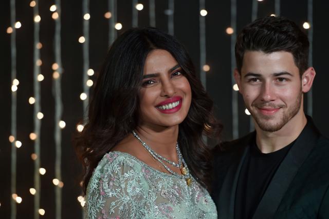 Priyanka Chopra and US musician Nick Jonas during a reception in Mumbai. (Photo by PUNIT PARANJPE / AFP) (AFP) Priyanka Chopra and US musician Nick Jonas during a reception in Mumbai. (Photo by PUNIT PARANJPE / AFP) (AFP)