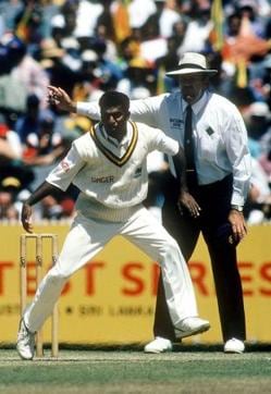 Muttiah Muralitharan looks on after bowling the ball as umpire Darell Hair calls no-ball. (Getty Image) Muttiah Muralitharan looks on after bowling the ball as umpire Darell Hair calls no-ball. (Getty Image)