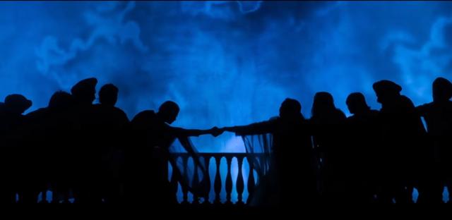 A scene from the play shows two women being torn apart.