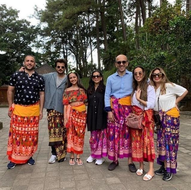 Anil Kapoor and wife Sunita in colourful sarongs. Anil Kapoor and wife Sunita in colourful sarongs.