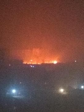 Fire in the shanties in Noida sector 73 as seen from a nearby building. (Nandini /HT Photo)