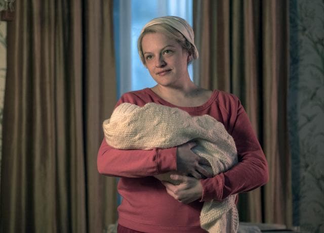 This image released by Hulu shows Elisabeth Moss in a scene from The Handmaid's Tale. (AP) This image released by Hulu shows Elisabeth Moss in a scene from The Handmaid's Tale. (AP)