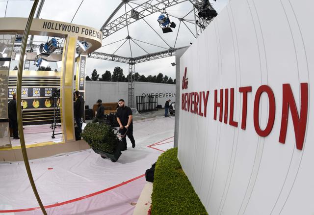 Workers and staff prepare the red carpet area for Sunday's the 76th Golden Globe Awards, at the Beverly Hilton hotel in Beverly Hills. (AFP) Workers and staff prepare the red carpet area for Sunday's the 76th Golden Globe Awards, at the Beverly Hilton hotel in Beverly Hills. (AFP)