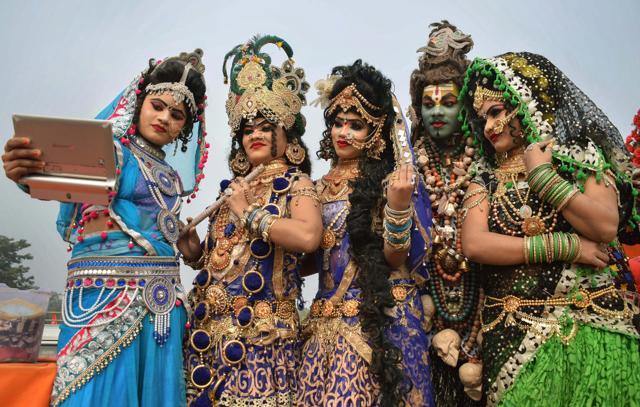 Artists dressed as various gods and goddesses take selfie during 'Peshwai' ceremony (Royal entry) for the Kumbh Mela 2019, in Prayagraj, Monday, Jan 7, 2019. (PTI) Artists dressed as various gods and goddesses take selfie during 'Peshwai' ceremony (Royal entry) for the Kumbh Mela 2019, in Prayagraj, Monday, Jan 7, 2019. (PTI)