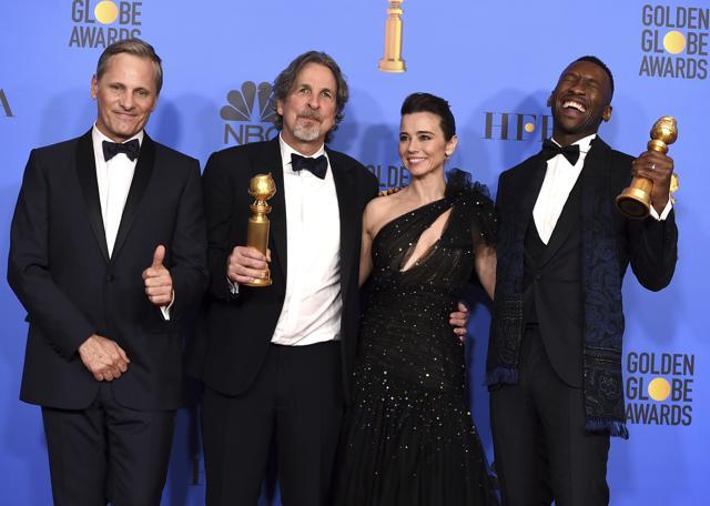 Viggo Mortensen, from left, Peter Farrelly, Linda Cardellini and Mahershala Ali, winner of the award for best performance by an actor in a supporting role in any motion picture for Green Book, pose in the press room with the award for best motion picture, musical or comedy for Green Book at the 76th annual Golden Globe Awards. (Jordan Strauss/Invision/AP) Viggo Mortensen, from left, Peter Farrelly, Linda Cardellini and Mahershala Ali, winner of the award for best performance by an actor in a supporting role in any motion picture for Green Book, pose in the press room with the award for best motion picture, musical or comedy for Green Book at the 76th annual Golden Globe Awards. (Jordan Strauss/Invision/AP)