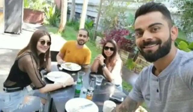 Anushka Sharma and Virat Kohli with friends.