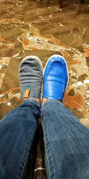 Murthy’s mismatched shoes.