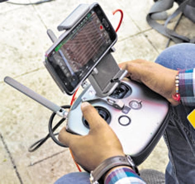 These drones are operated by multiple pilots. One pilot is solely responsible for navigation, while the other is in charge of the camera – ensuring it moves along with the particular event. (Milind Saurkar/HT Photo)