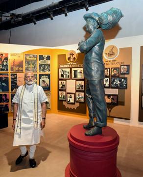 Prime Minister Narendra Modi looks at the statue of showman Rajkapoor during the opening of the National Museum of Indian Cinema in Mumbai, Saturday, Jan 19, 2019. (PTI Photo/Shirish Shete) (PTI) Prime Minister Narendra Modi looks at the statue of showman Rajkapoor during the opening of the National Museum of Indian Cinema in Mumbai, Saturday, Jan 19, 2019. (PTI Photo/Shirish Shete) (PTI)