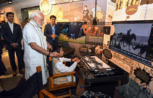 Prime Minister Narendra Modi visits the childre's film section at newly opened National Museum of Indian Cinema in Mumbai, Saturday, Jan 19, 2019. Minister of State for I & B Rajyavardhan Singh Rathore is also seen. (PTI Photo/Shirish Shete) (PTI) Prime Minister Narendra Modi visits the childre's film section at newly opened National Museum of Indian Cinema in Mumbai, Saturday, Jan 19, 2019. Minister of State for I & B Rajyavardhan Singh Rathore is also seen. (PTI Photo/Shirish Shete) (PTI)