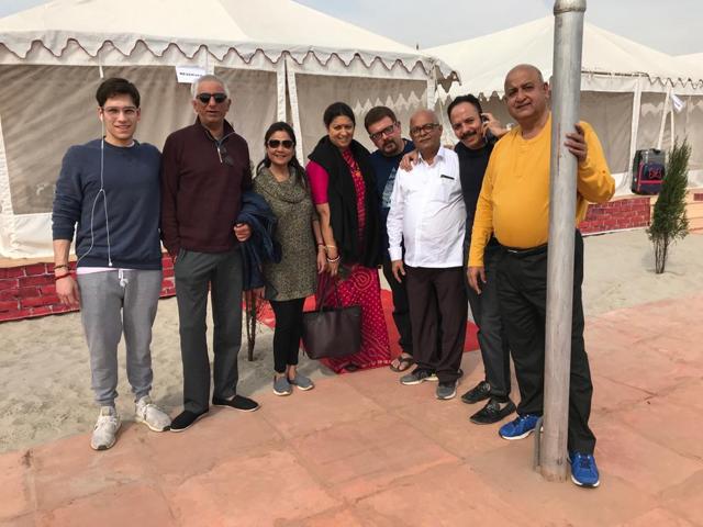 Mickey Mehta (second from right), Zubin Irani (fourth from right) and Smriti Irani (centre) with friends at the Kumbh. (HT Photo)