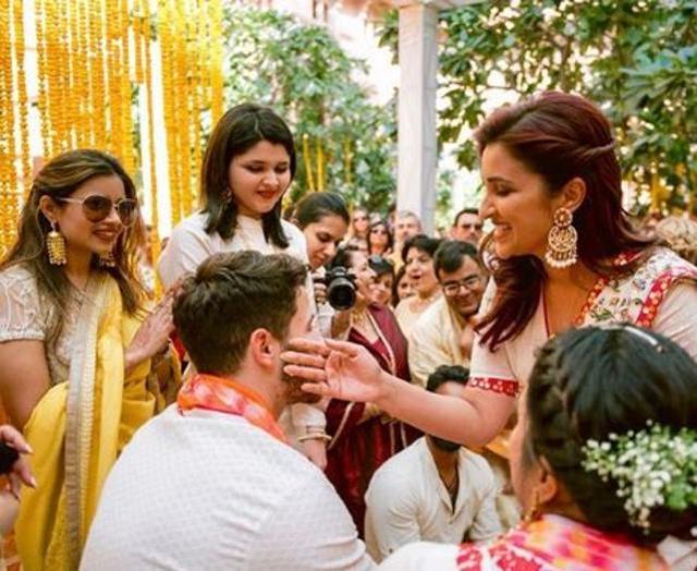 Parineeti applying haldi to Nick’s face. (Instagram)