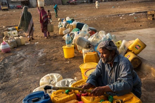 A man fills containers with water in Karachi. Photographer: Asim Hafeez/Bloomberg (Bloomberg) A man fills containers with water in Karachi. Photographer: Asim Hafeez/Bloomberg (Bloomberg)