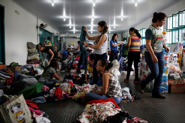 Volunteers prepare donations for people affected after a dam burst in Brumadinho, Brazil. (REUTERS) Volunteers prepare donations for people affected after a dam burst in Brumadinho, Brazil. (REUTERS)