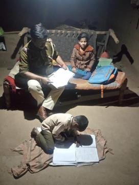 Chandmal Singariya, SHO of Kotwali police station in Dungarpur district, at the house of Jaya Gameti, a Class 7 student of senior secondary school at Bori village in the district. (HT Photo ) Chandmal Singariya, SHO of Kotwali police station in Dungarpur district, at the house of Jaya Gameti, a Class 7 student of senior secondary school at Bori village in the district. (HT Photo )