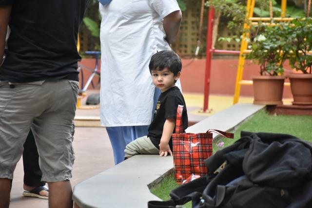 Taimur looks at the camera.