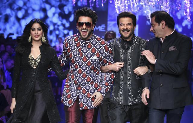 Bollywood actors Janhvi Kapoor, Ranveer Singh and Anil Kapoor walk the ramp showcasing a creation by designer Raghavendra Rathore at the Lakmé Fashion Week (LFW) Summer Resort 2019. (PTI) Bollywood actors Janhvi Kapoor, Ranveer Singh and Anil Kapoor walk the ramp showcasing a creation by designer Raghavendra Rathore at the Lakmé Fashion Week (LFW) Summer Resort 2019. (PTI)