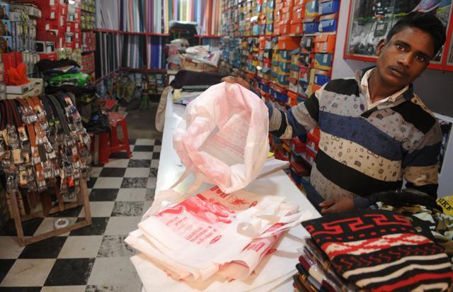 A shopkeeper shows a cloth bag at Kasan village, in Gurugram. All shops in Kasan have turned polythene free, and use only non-woven fabric bags after the panchayat made it compulsory to do so. (Parveen Kumar / HT Photo ) A shopkeeper shows a cloth bag at Kasan village, in Gurugram. All shops in Kasan have turned polythene free, and use only non-woven fabric bags after the panchayat made it compulsory to do so. (Parveen Kumar / HT Photo )
