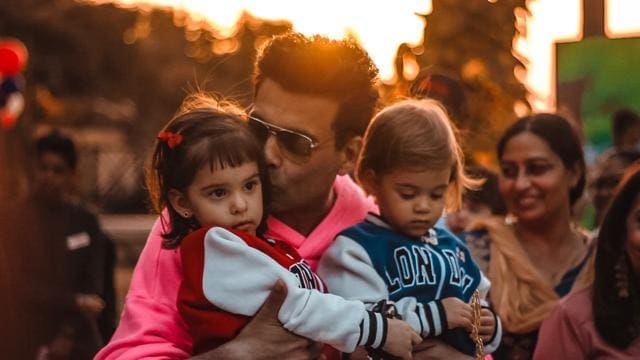 Karan Johar plants a kiss on daughter Roohi’s head during the cake cutting ceremony. Karan Johar plants a kiss on daughter Roohi’s head during the cake cutting ceremony.