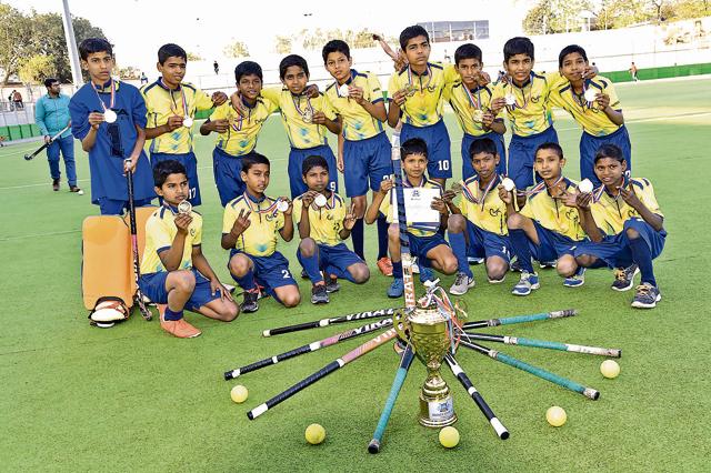 The Lokseva Pratisthan u-13 team winners with medals and trophy. (HT PHOTO)