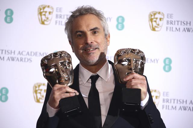 Director Alfonso Cuaron poses for photographers backstage with his Best Film and Best Director award for his film Roma at the BAFTA awards in London. (Joel C Ryan/Invision/AP) Director Alfonso Cuaron poses for photographers backstage with his Best Film and Best Director award for his film Roma at the BAFTA awards in London. (Joel C Ryan/Invision/AP)
