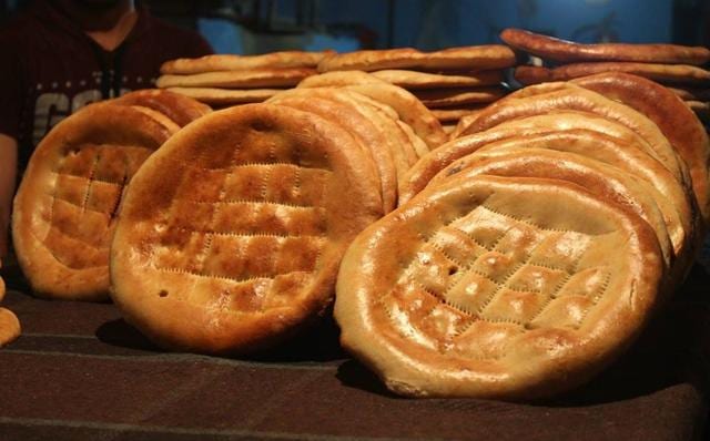 In the Afghan settlement in Bhogal in south Delhi, delicious breads emerge from tandoors that look like pizza ovens, with the breads stuck on the outer walls. In the Afghan settlement in Bhogal in south Delhi, delicious breads emerge from tandoors that look like pizza ovens, with the breads stuck on the outer walls.
