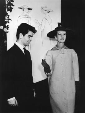 FILE -- In this Nov. 30, 1953 photo German fashion designer Karl Lagerfeld, left, poses with an unidentified model in Germany, City not known. Chanel's iconic couturier, Karl Lagerfeld, whose accomplished designs as well as trademark white ponytail, high starched collars and dark enigmatic glasses dominated high fashion for the last 50 years, has died. He was around 85 years old. (Werner Baum/dpa via AP, file) (AP) FILE -- In this Nov. 30, 1953 photo German fashion designer Karl Lagerfeld, left, poses with an unidentified model in Germany, City not known. Chanel's iconic couturier, Karl Lagerfeld, whose accomplished designs as well as trademark white ponytail, high starched collars and dark enigmatic glasses dominated high fashion for the last 50 years, has died. He was around 85 years old. (Werner Baum/dpa via AP, file) (AP)