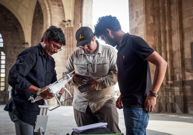 Avidan Fernandez (middle), field capture specialist from CyArk, worked with the members of Quidich Innovation Labs, who provided drones for the project. Avidan Fernandez (middle), field capture specialist from CyArk, worked with the members of Quidich Innovation Labs, who provided drones for the project.