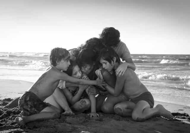 This image released by Netflix shows Yalitza Aparicio, centre, in a scene from the film Roma, by filmmaker Alfonso Cuaron. (AP) This image released by Netflix shows Yalitza Aparicio, centre, in a scene from the film Roma, by filmmaker Alfonso Cuaron. (AP)