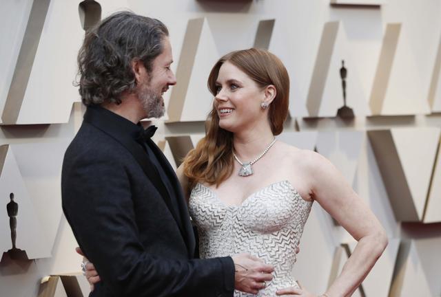 Best Supporting Actress nominee Amy Adams arrives with her husband Darren Le Gallo. (REUTERS) Best Supporting Actress nominee Amy Adams arrives with her husband Darren Le Gallo. (REUTERS)