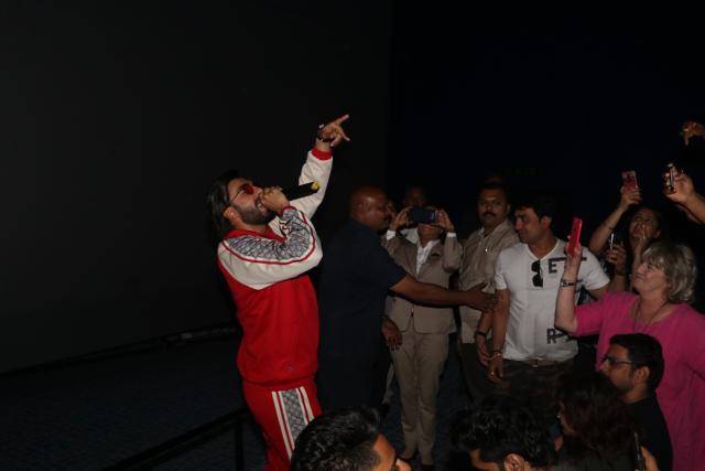 Ranveer Singh performs at a movie theatre.