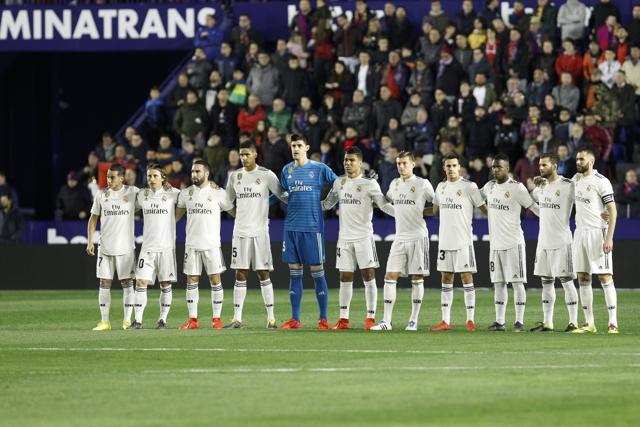 Real Madrid players stand prior the La Liga match against Levante. (AP) Real Madrid players stand prior the La Liga match against Levante. (AP)