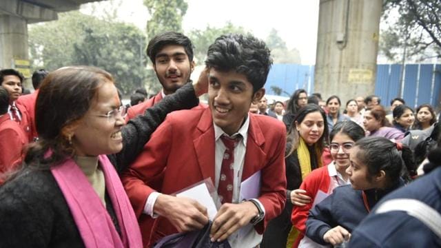 Parents showering blessings to their children before Board exams. Parents showering blessings to their children before Board exams.