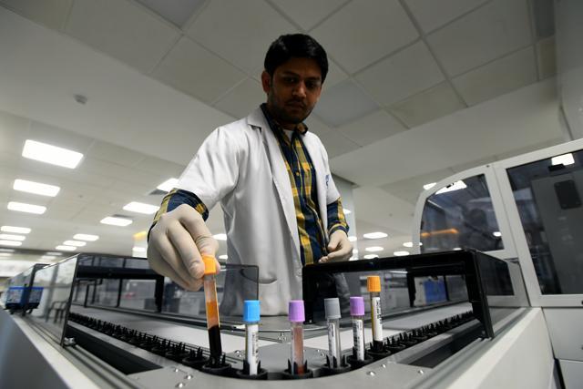The centralised lab at NCI has a capacity to test 60,000 samples a day and run 24x7. (Amal KS/HT PHOTO)