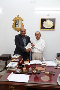 Mujibur Rehman, editor of Rise of Saffron Power, with former president Pranab Mukherjee (Courtesy Mujibur Rehman)