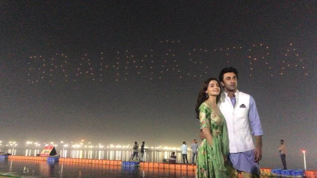 Alia Bhatt and Ranbir Kapoor with a backdrop of their upcoming film logo Brahmastra at Sangam. (IANS)