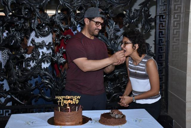 Aamir Khan feeds birthday cake to wife Kiran.