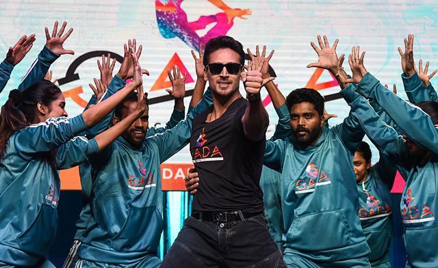 Tiger Shroff performs along with dancers during the launch of Ganesh Acharya Dance Academy in Mumbai. (AFP) Tiger Shroff performs along with dancers during the launch of Ganesh Acharya Dance Academy in Mumbai. (AFP)
