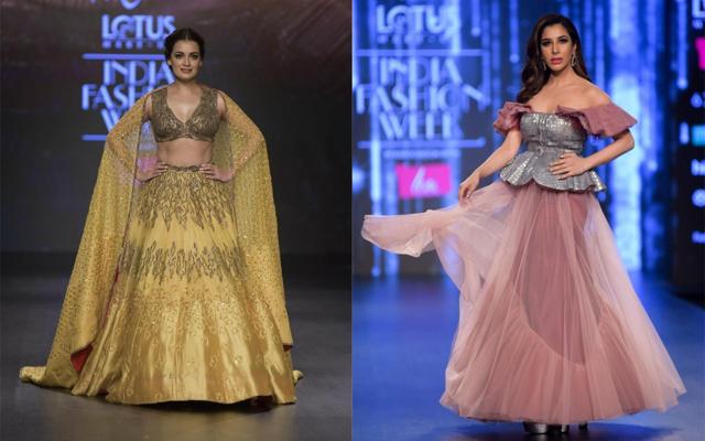 Dia Mirza walks the ramp for Ruceru and Sophie Choudry showcasing work of fashion designer Tisharth by Shivani at India Fashion Week. (PTI)