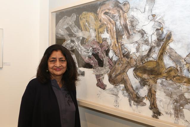 Artist Meena Deora with her artwork Transcedental 1, which is a mixed media on paper. (Prabhas Roy/HT)