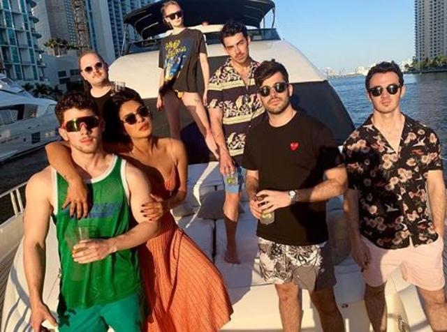 Nick, Joe and Kevin Jonas pose in a group picture with Priyanka Chopra and Sophie Turner.
