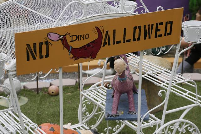 A figurine of Dino, the pet dinosaur, stands in a carriage in the front yard of the Flintstone House. (AP) A figurine of Dino, the pet dinosaur, stands in a carriage in the front yard of the Flintstone House. (AP)