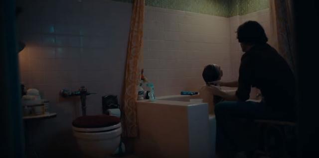 Arthur bathes his mother in a still from the Joker trailer.