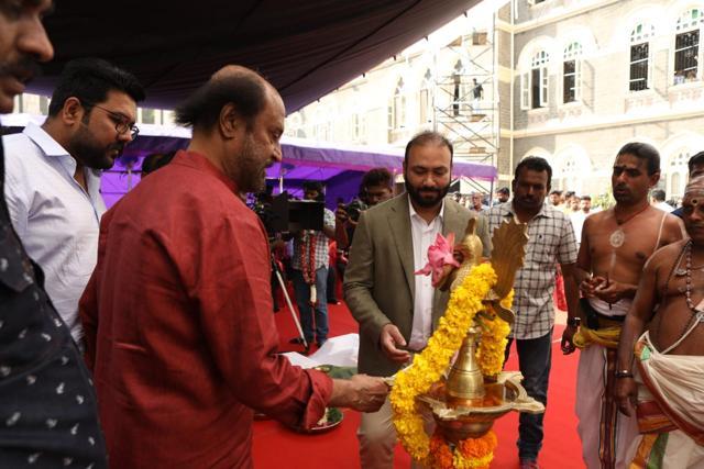Rajinikanth lights the lamp. Rajinikanth lights the lamp.