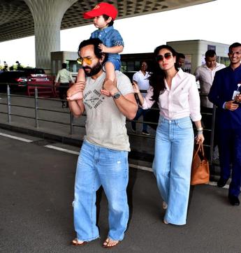 Kareena,Saif and Taimur captured together at the airport. Kareena,Saif and Taimur captured together at the airport.